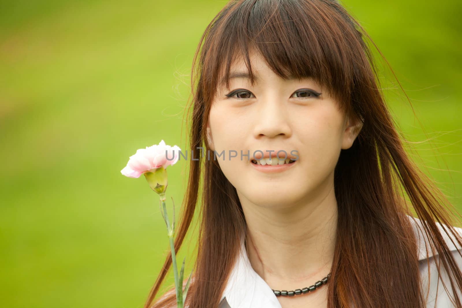 Thai girl holding her flower by artemisphoto