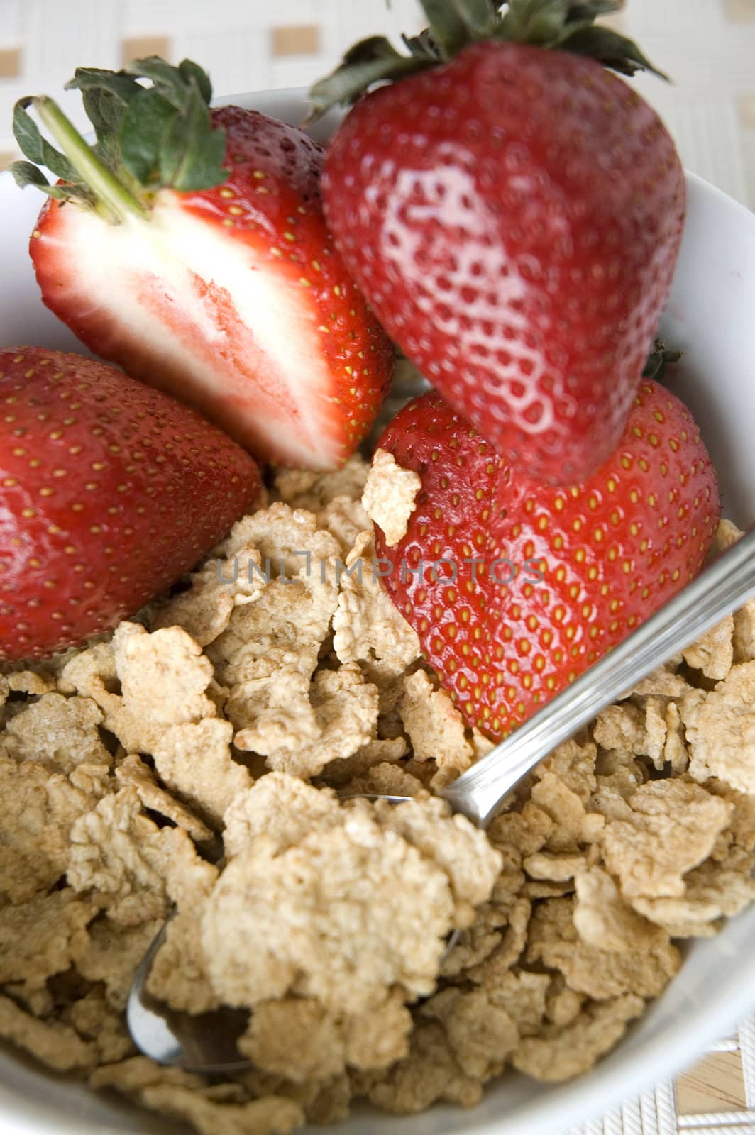 close up cereal with strawberry in bowl