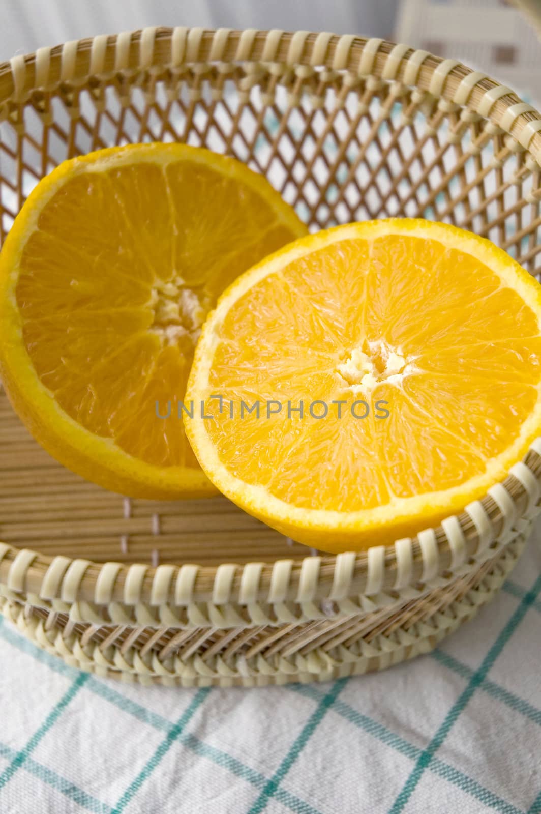 close up fresh half orange put in basket