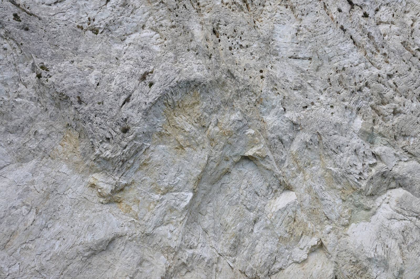 Steep mountain cliff rocky slope abstract stone background.