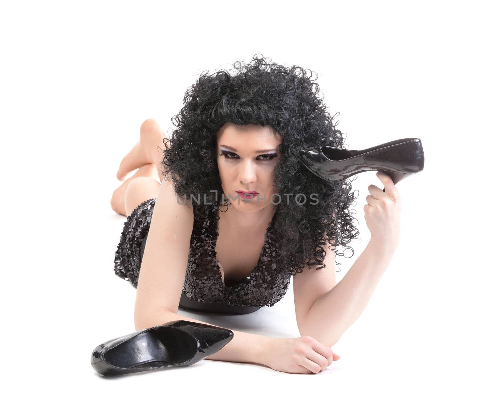 Portrait of drag queen lying on floor. Man dressed as Woman, isolated on white background