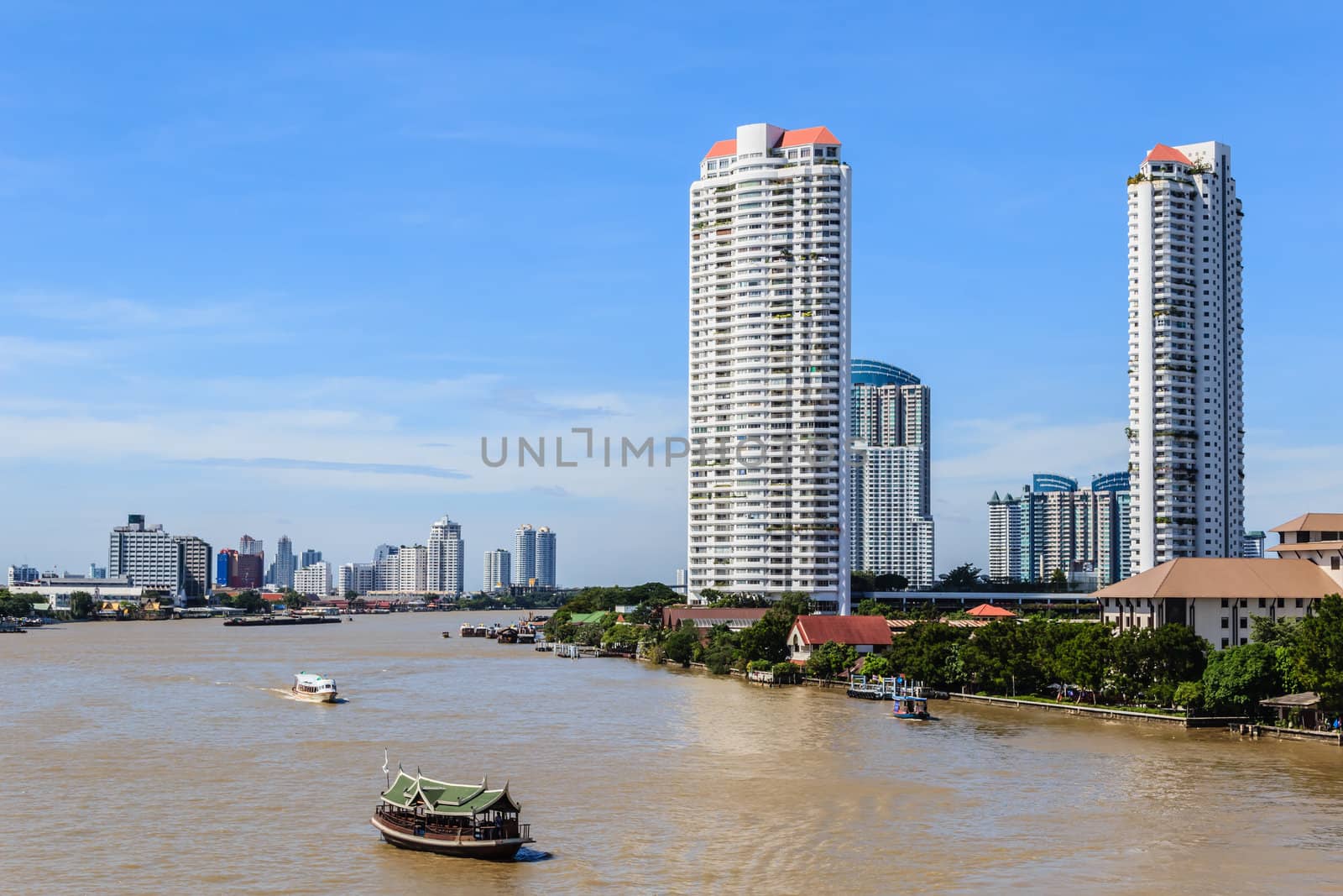 The riverside skyscraper buildings against the skyline in Bangkok, Thailand.