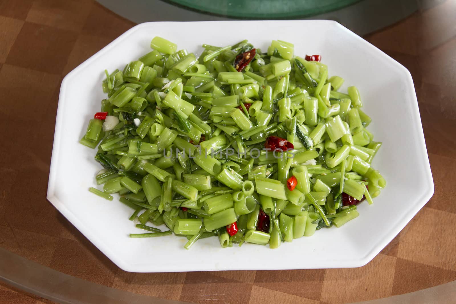 Fried Water Spinach closeup in a plate