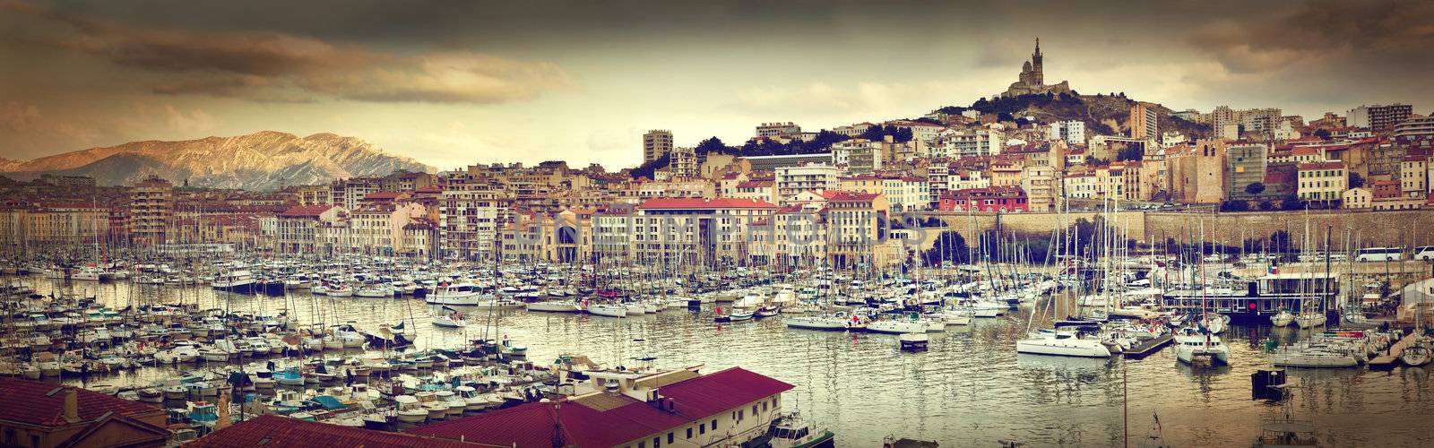 Marseille, France panorama at sunset. The famous european harbour view on the Notre Dame de la Garde