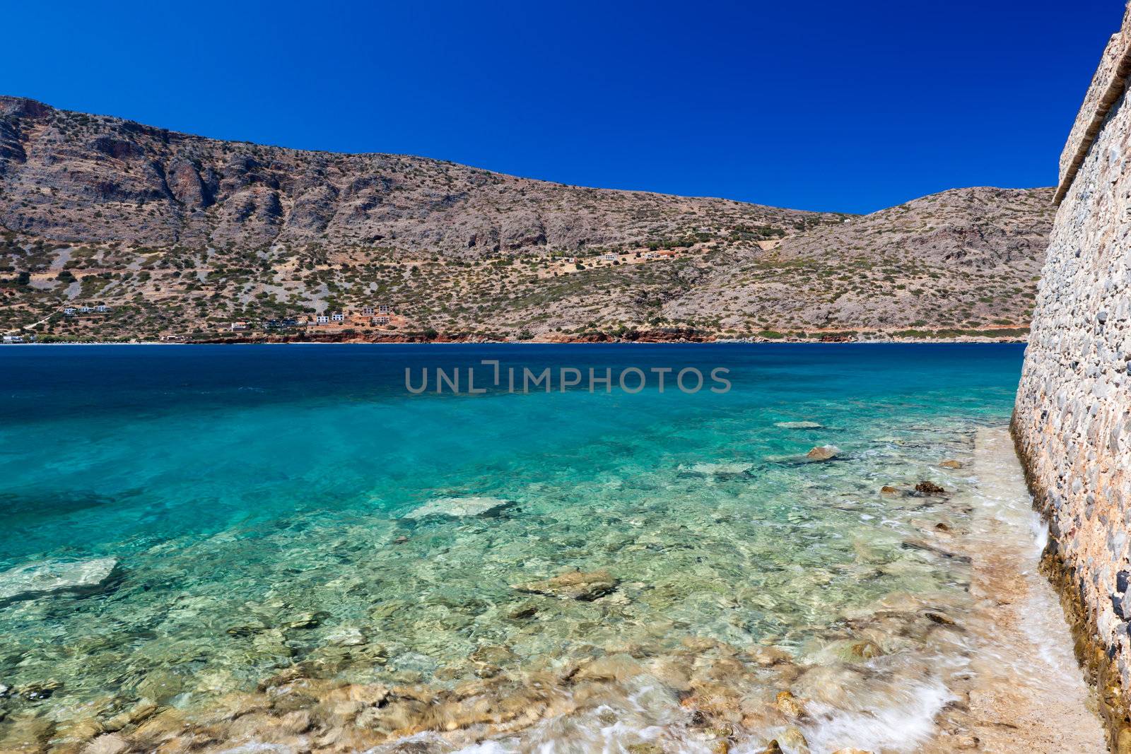 Spinalonga is a small island about Crete, located in the region of Lasithi in the Gulf of Mirabello, to the North of the villages of Plaka, Elounda