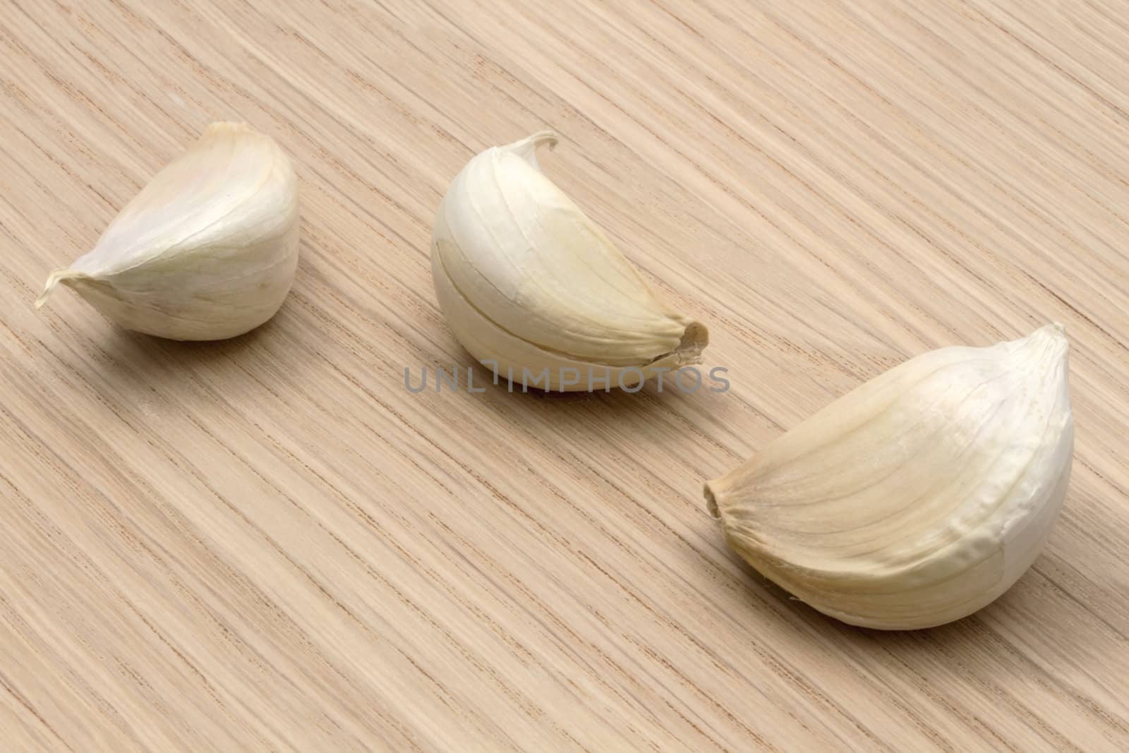 Garlic closeup on wood background 