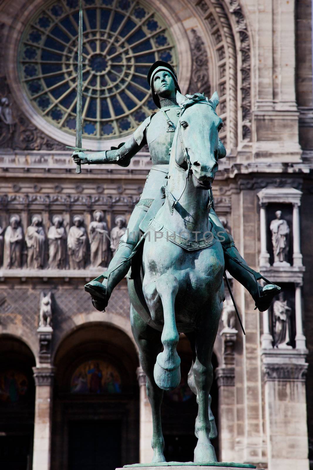 Jeanne d'Arc statue, Paris France. Saint Augustin church in the background