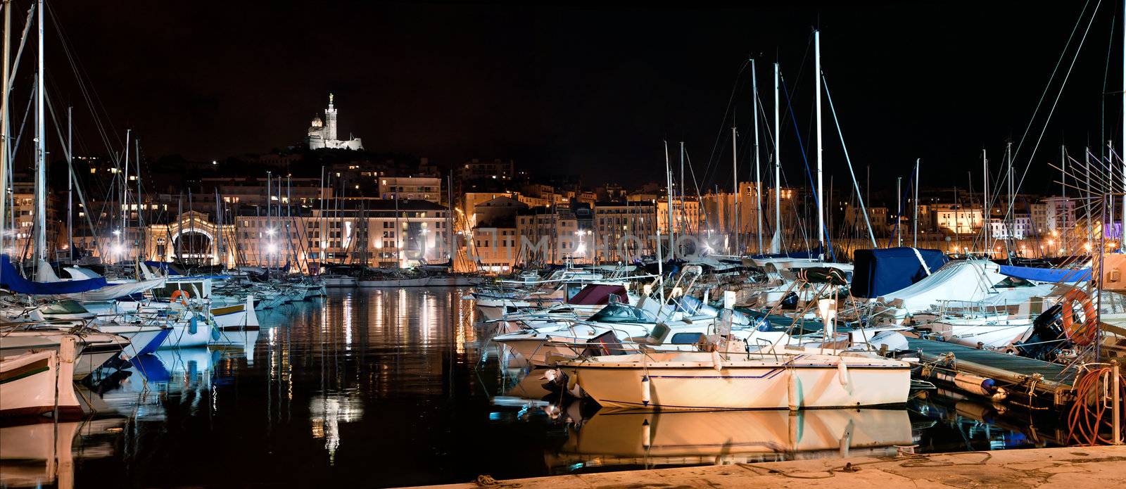 Marseille, France panorama at night, the harbour and cathedral. by photocreo