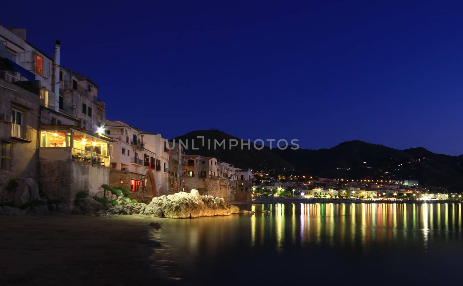 Chefalu  beach at sunset in sicily the largest of Italies islands