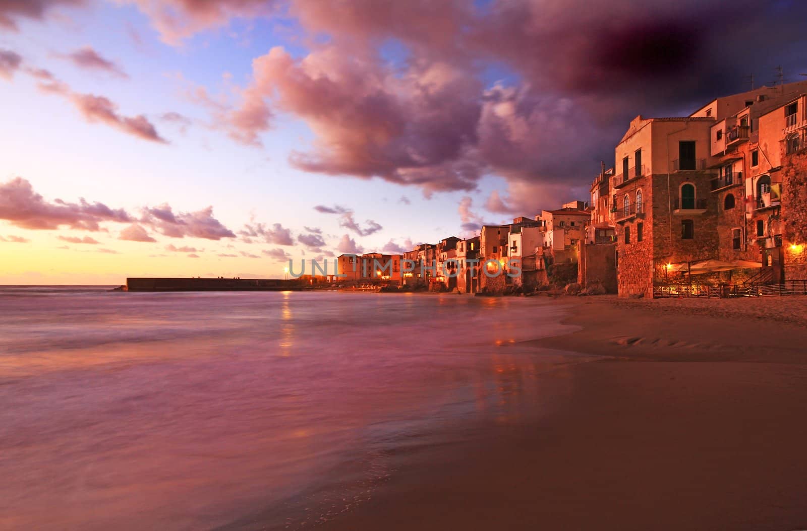 Chefalu  beach at sunset in sicily the largest of Italies islands