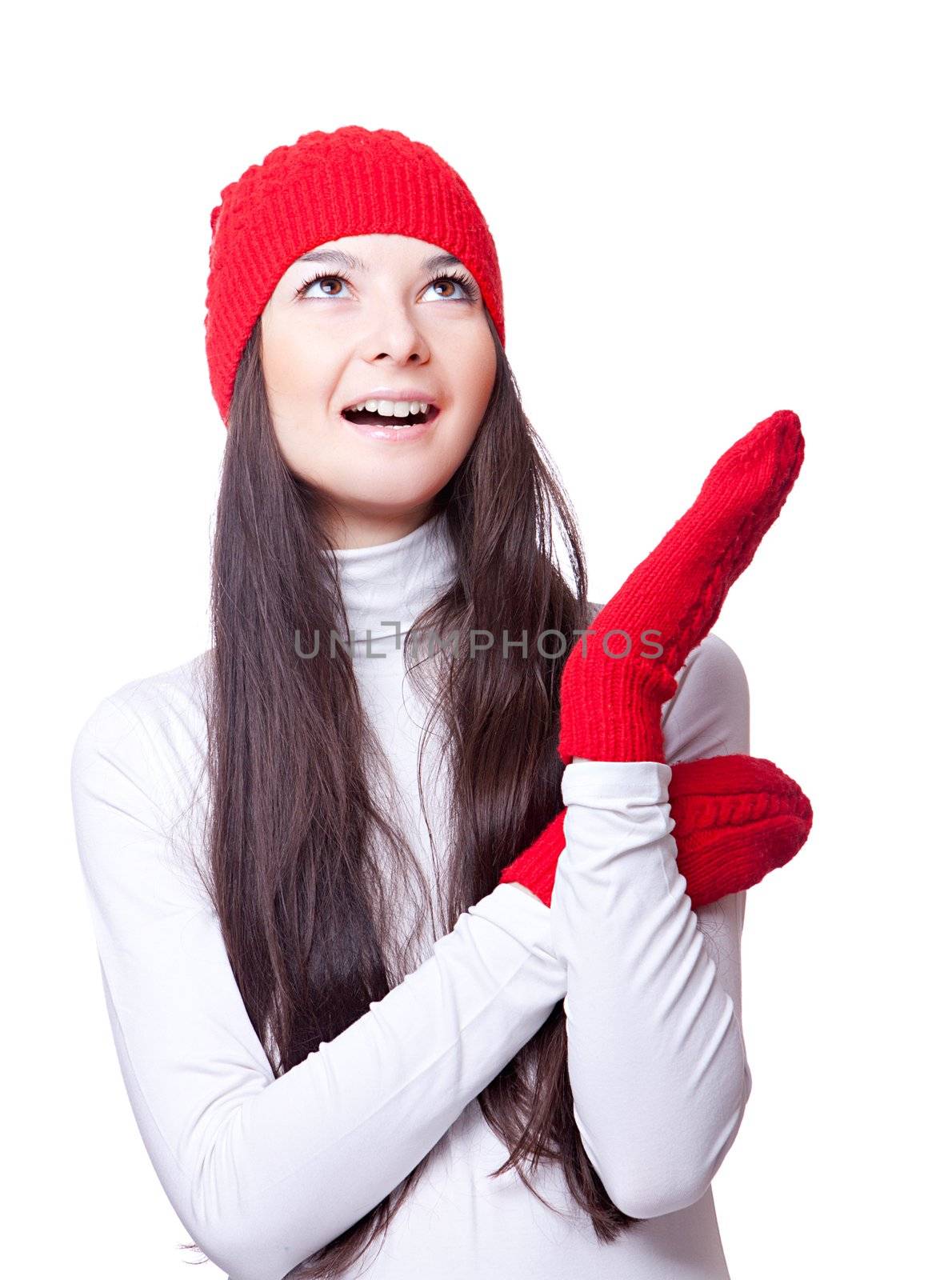 Christmas joyful woman in red cap and knitted mittens