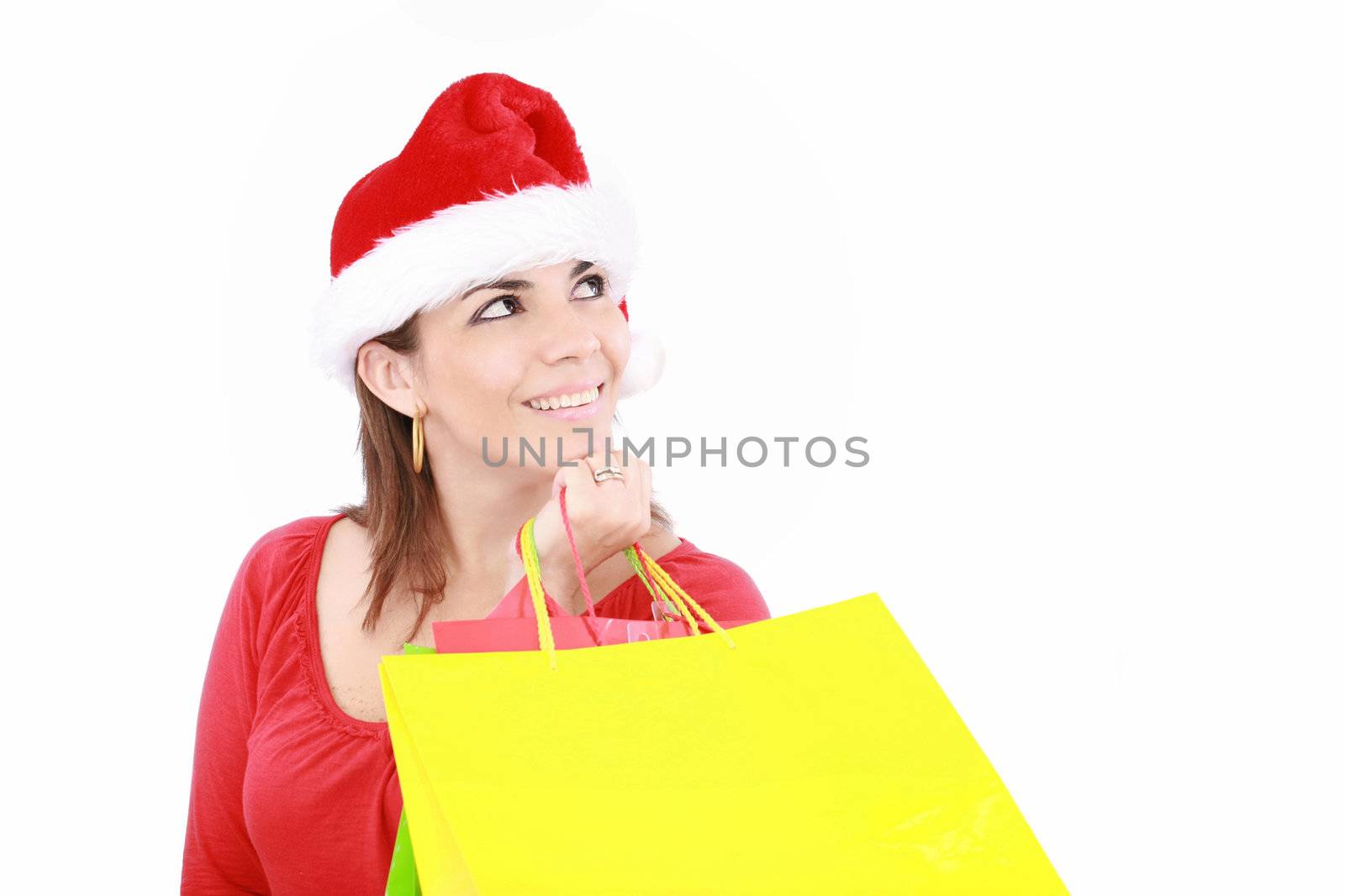 Attractive woman in Christmas cap hands packets, isolated on white