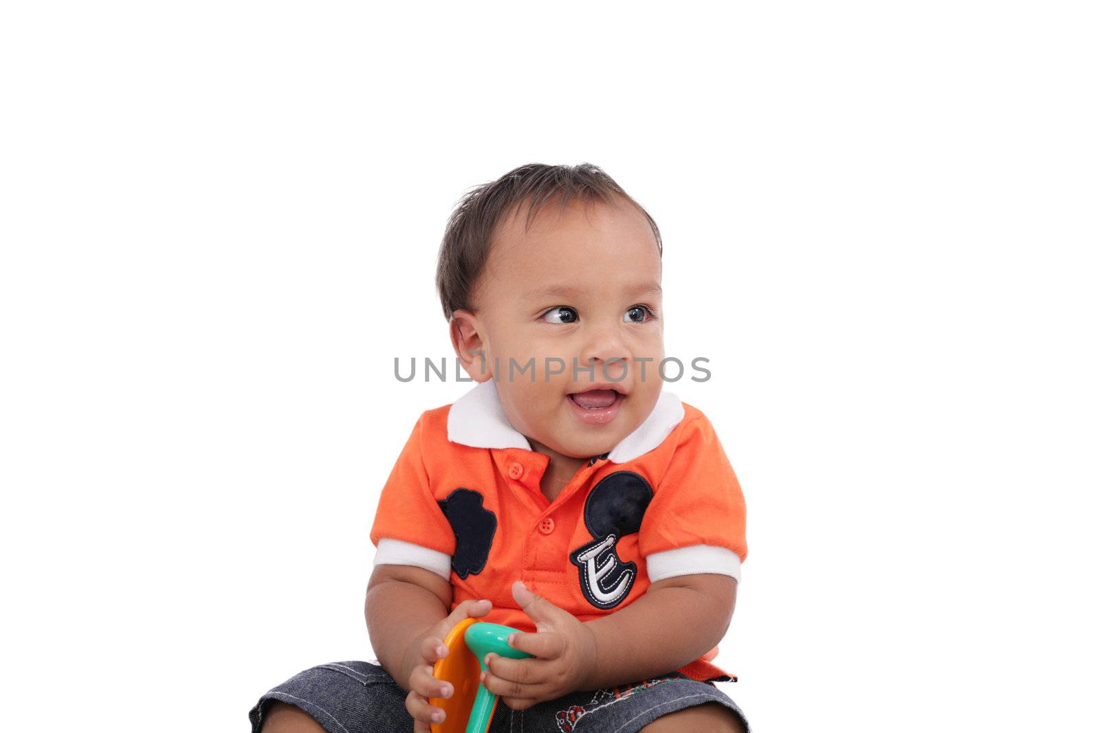 Adorable one year old child playing and having a good time, isolated on white