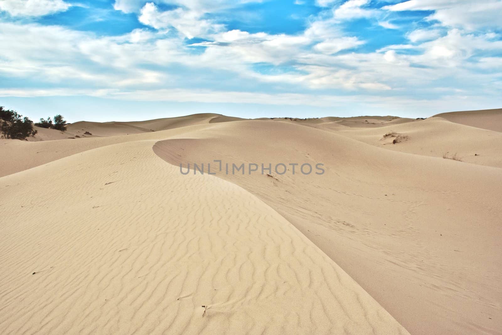 Sand hills with cloudy sky