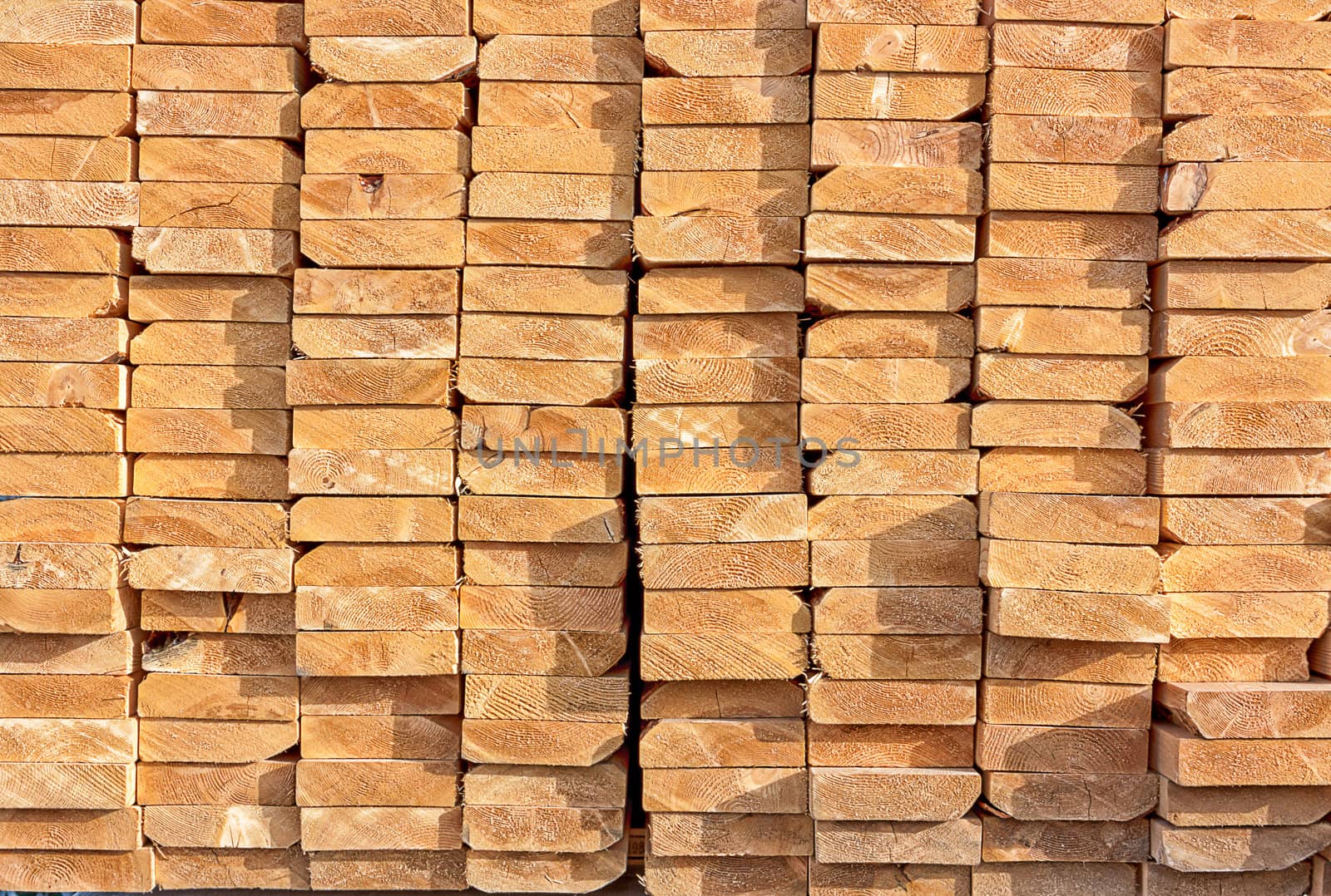 Stacked Lumber at Construction Site by wolterk