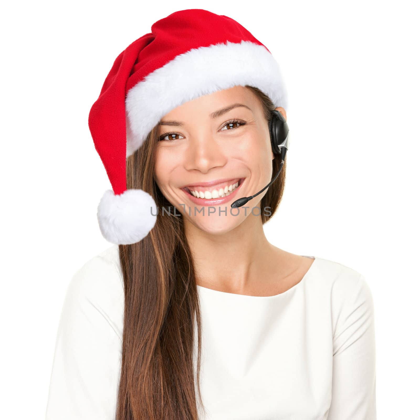 Christmas headset woman from telemarketing call center wearing red santa hat talking smiling isolated on white background.