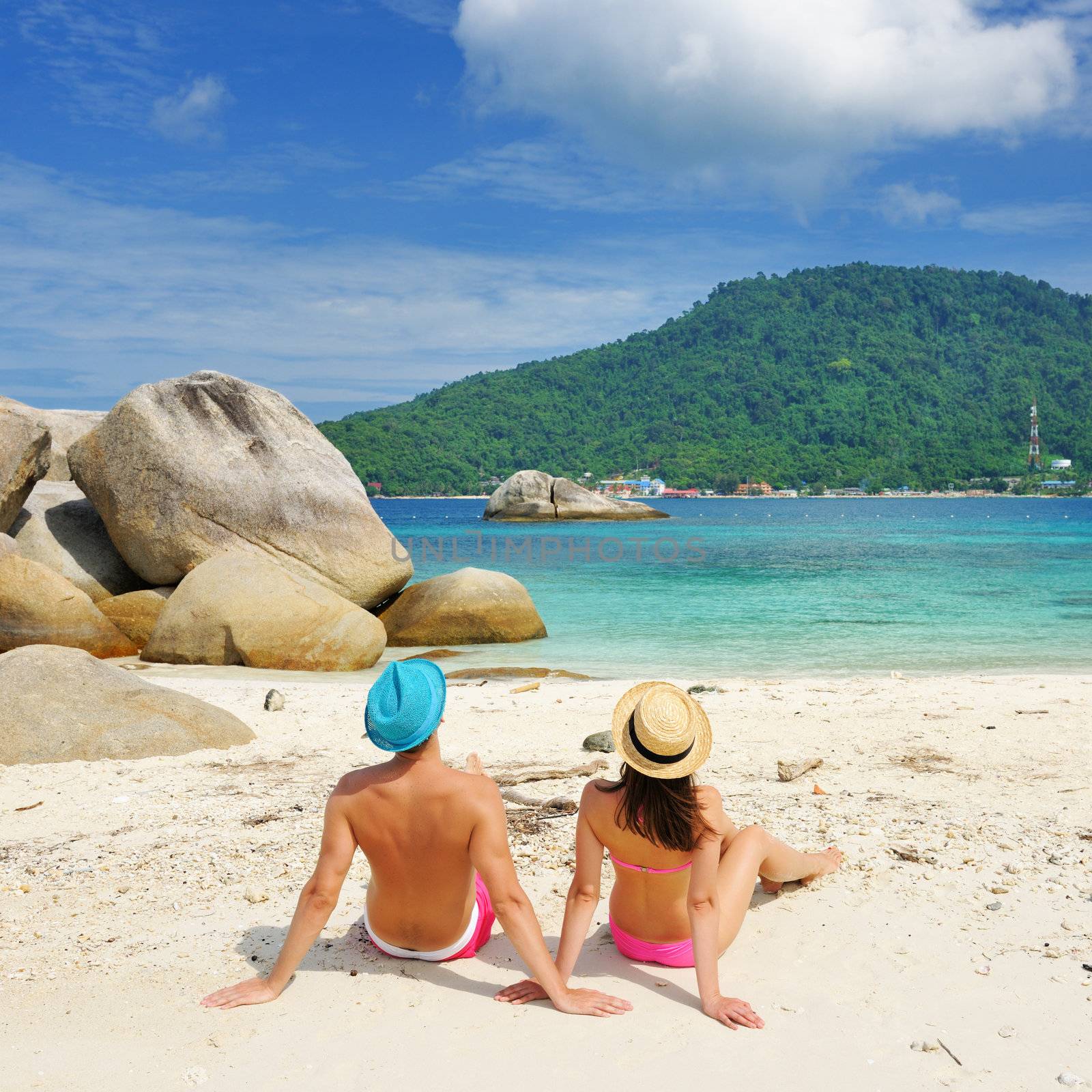 Couple on a beach by haveseen