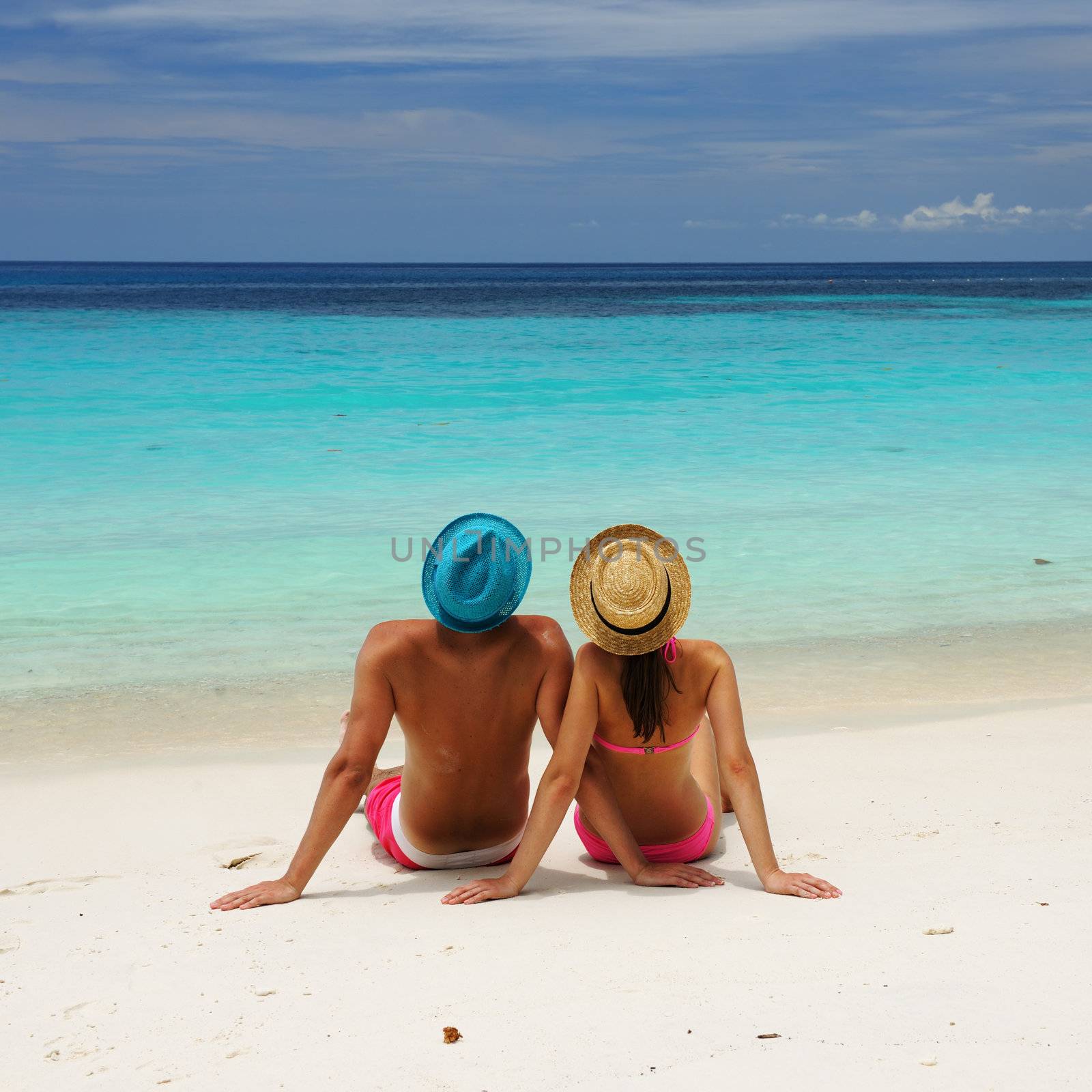 Couple on a beach by haveseen