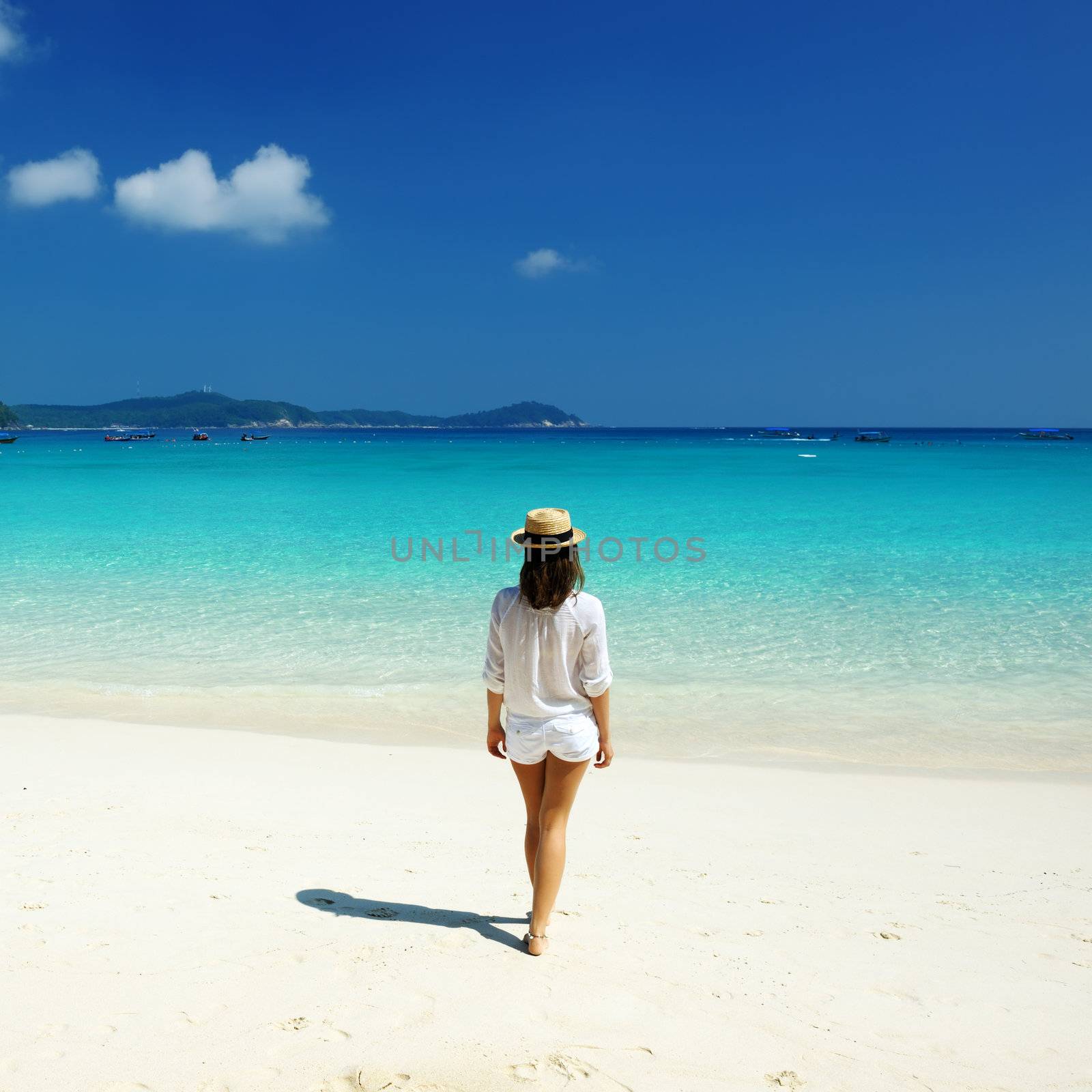 Woman in hat at beach