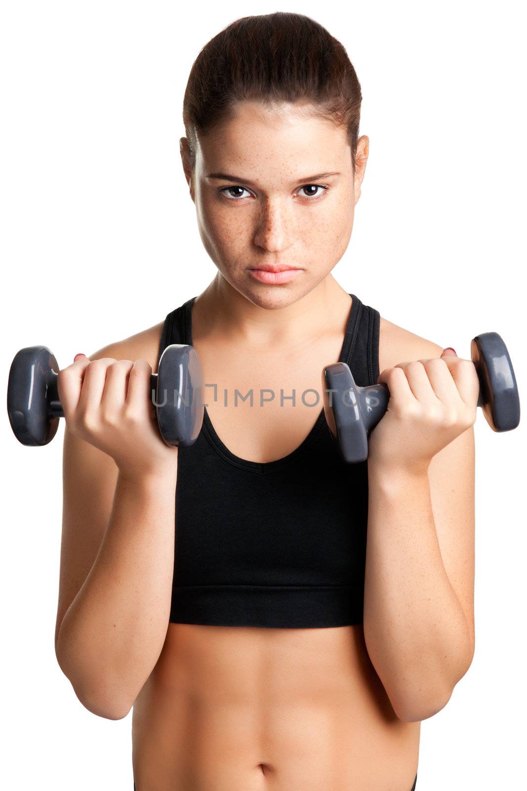 Woman working out with dumbbells at a gym