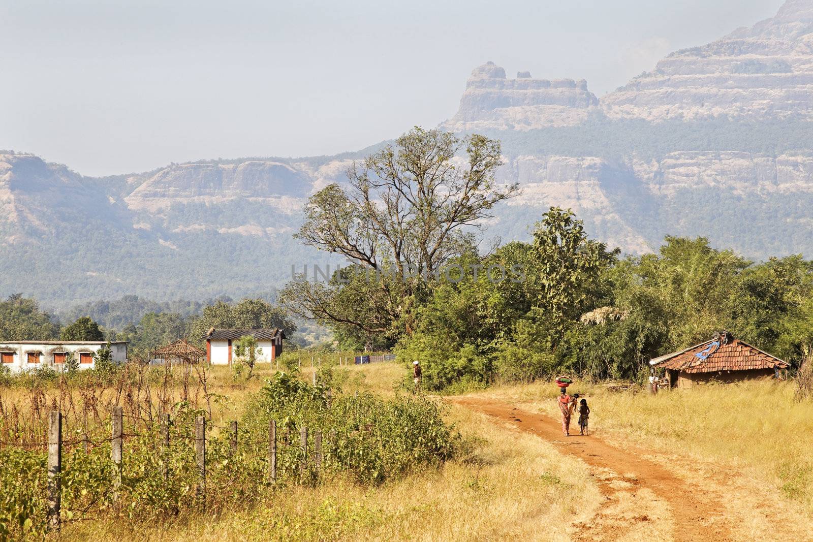 In the valley of the Sahyadhri mountains in Maharashtra India, contented families live and work as they have done for centuries, without electrical power or running water. Recycling, living of the land harvest and eco system where ever possible and almost everything is biodregadeable.