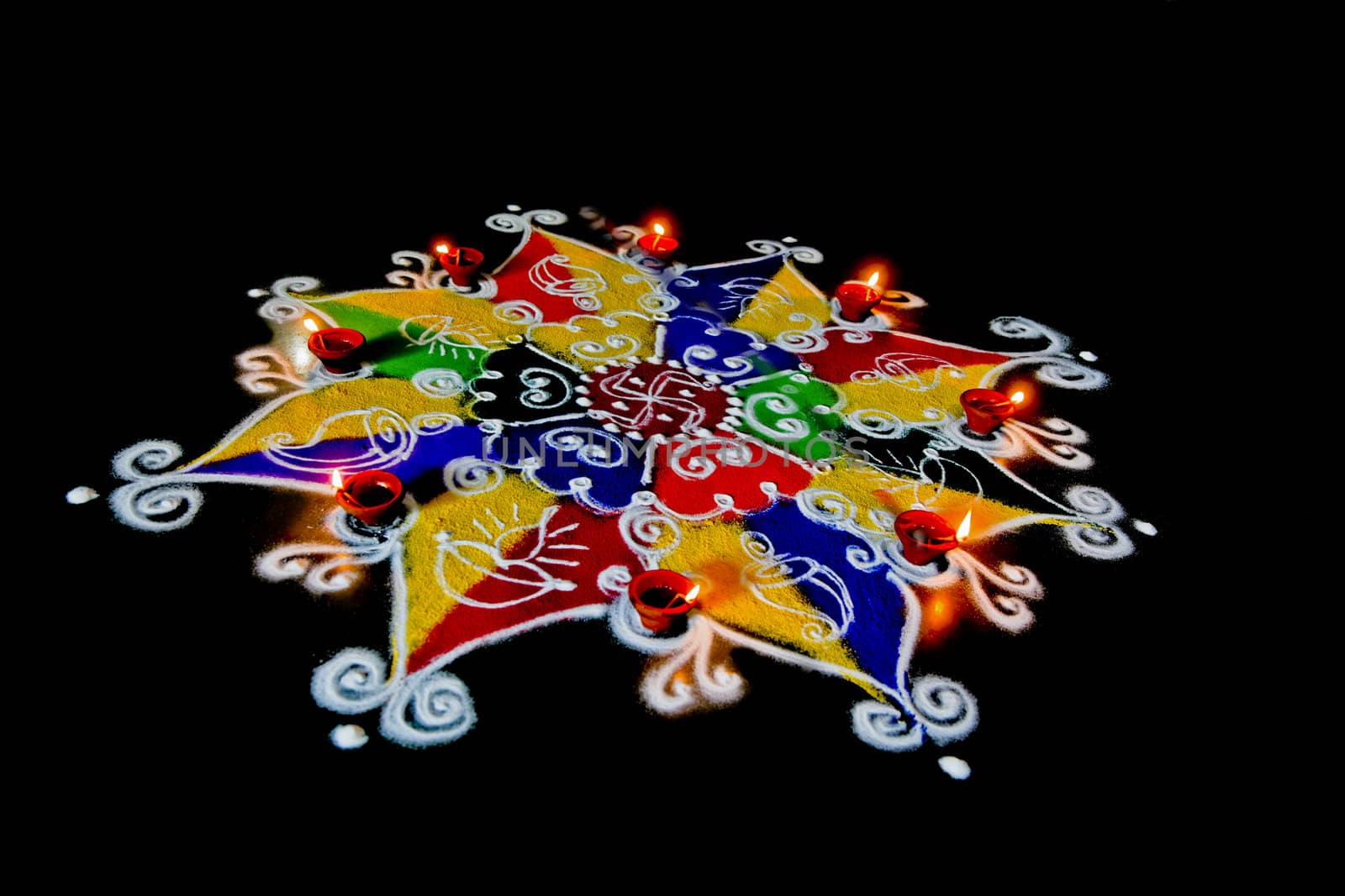 Rangoli, hand sketched patterns and designs filled colored powder are a common item in hindu homes at divali and new year usualy accompanied by ghee (butter) burning candles called diva