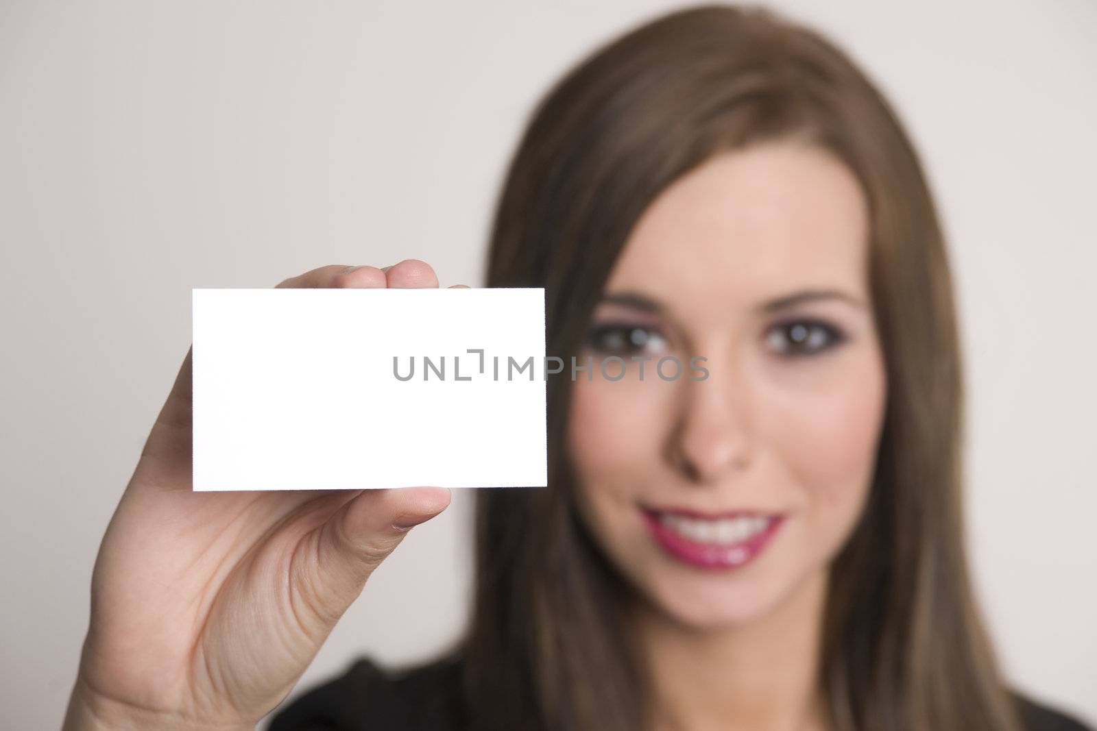 Woman holds a blank business card