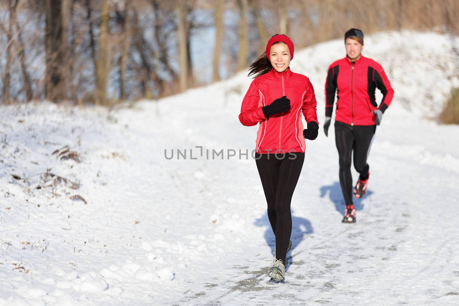 Winter running exercise couple by Maridav