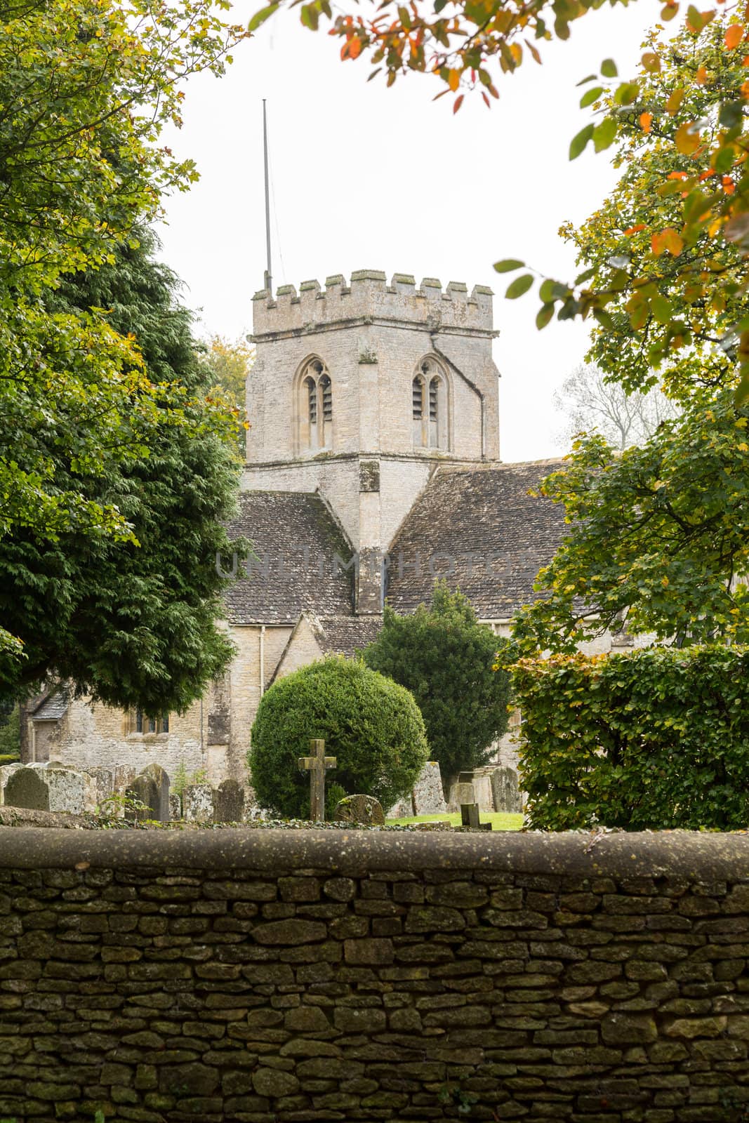 Church of Minster Lovell in Cotswold village with graveyard