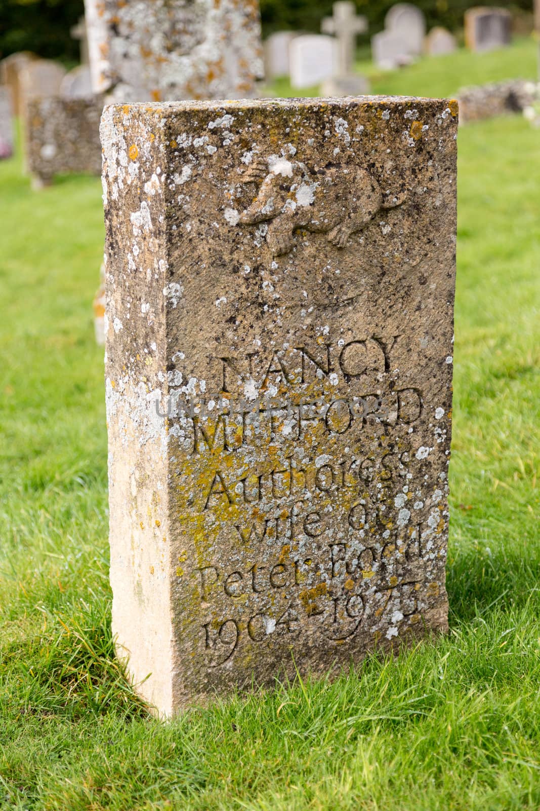 SWINBROOK, ENGLAND - OCTOBER 20: Gravestone for Nancy Mitford, famous Author. She died on 30 June 1973 and was buried in Swinbrook.