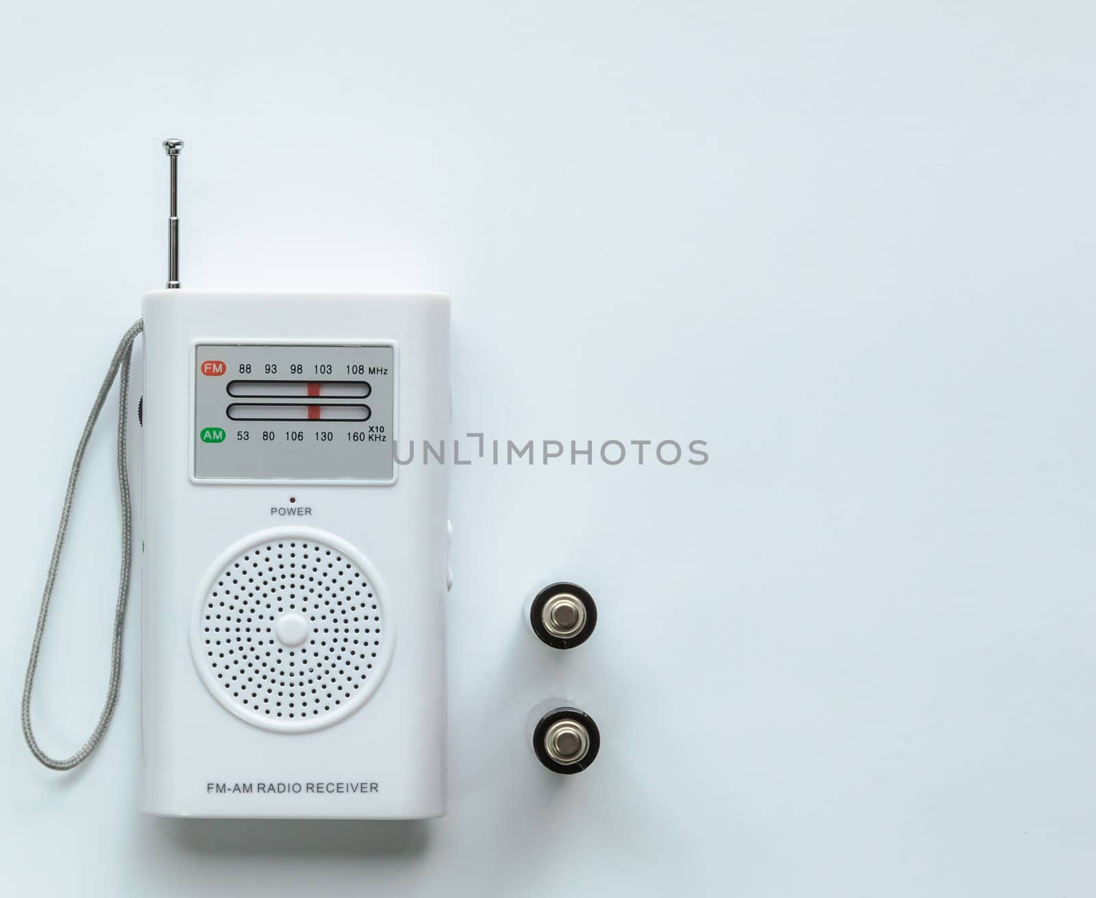 Small White Radio Receiver with two Batteries by punpleng
