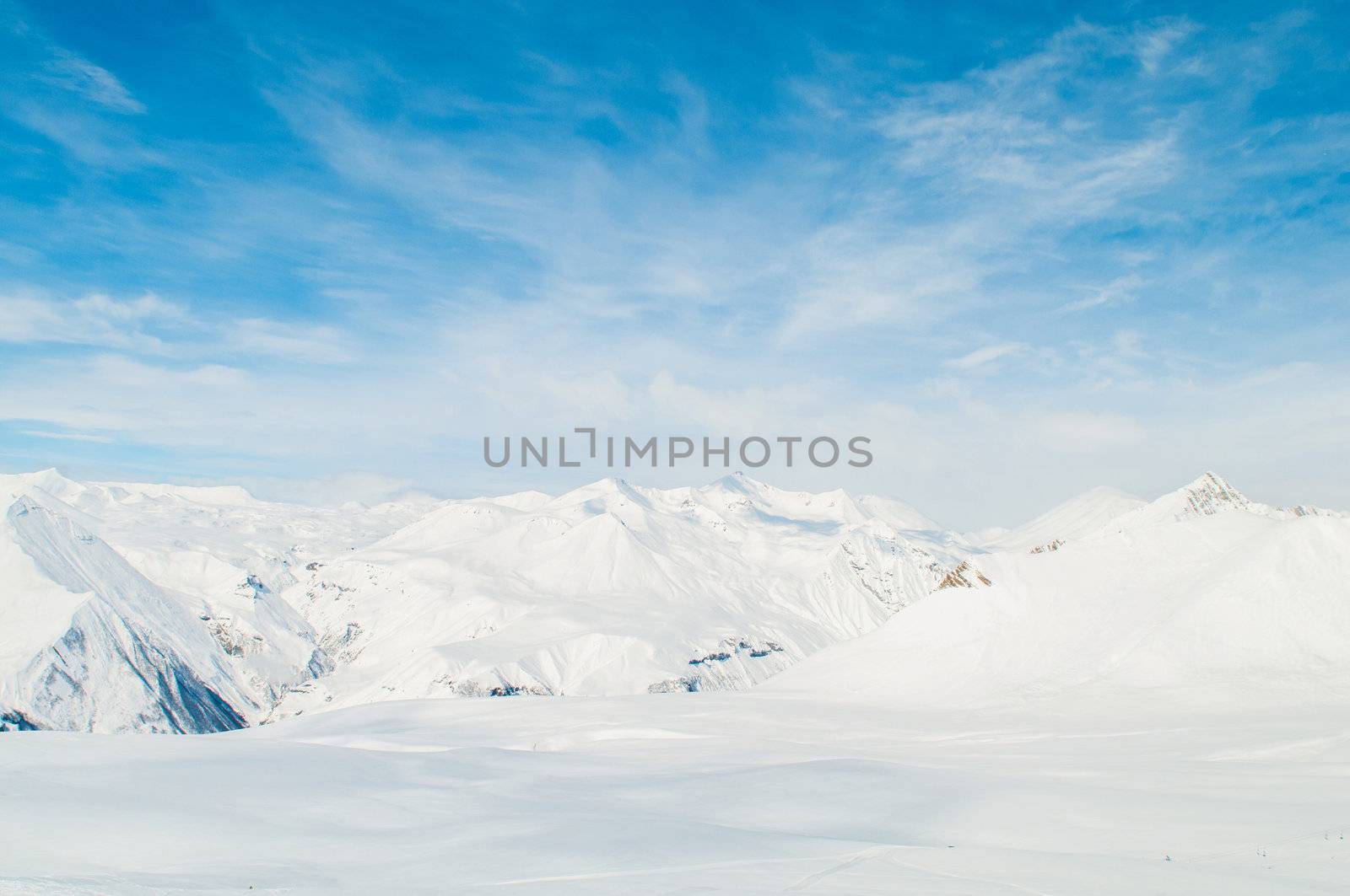 Snow mountains on bright winter day