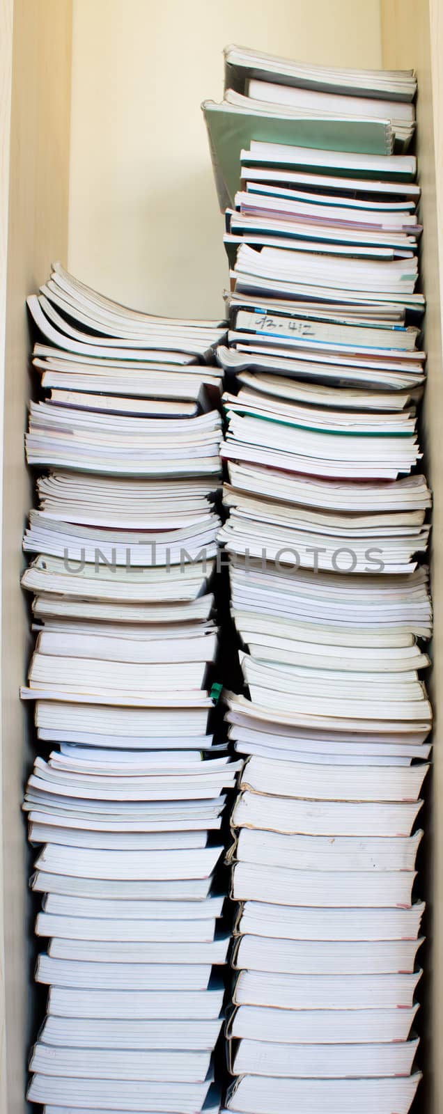 High stack of used books by catalinr