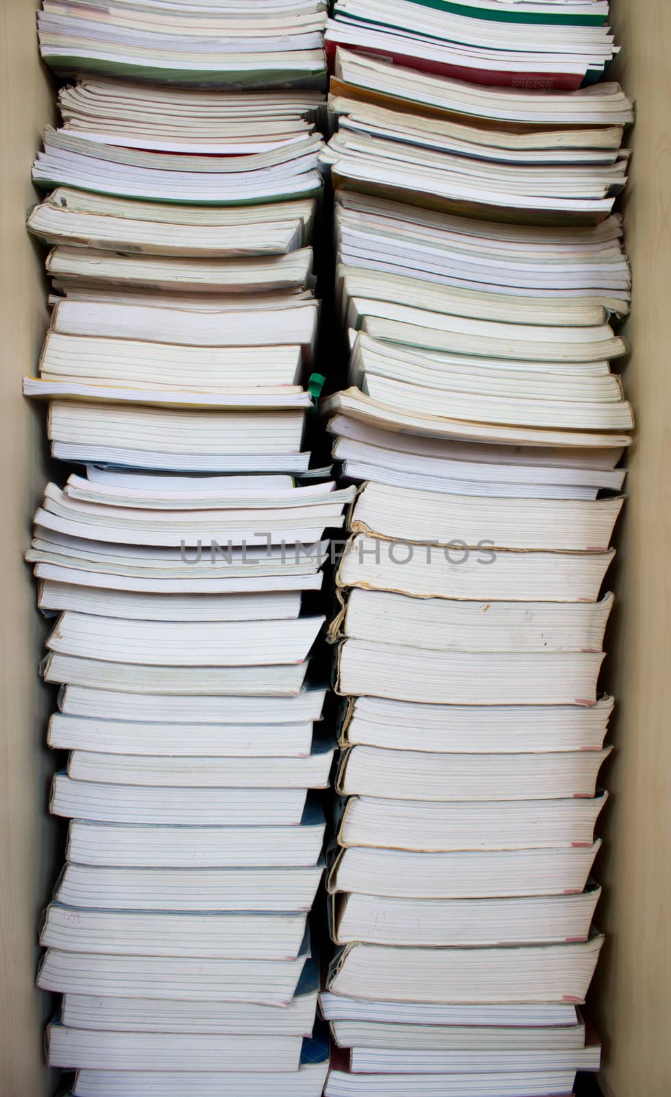 High stack of used books in a library 