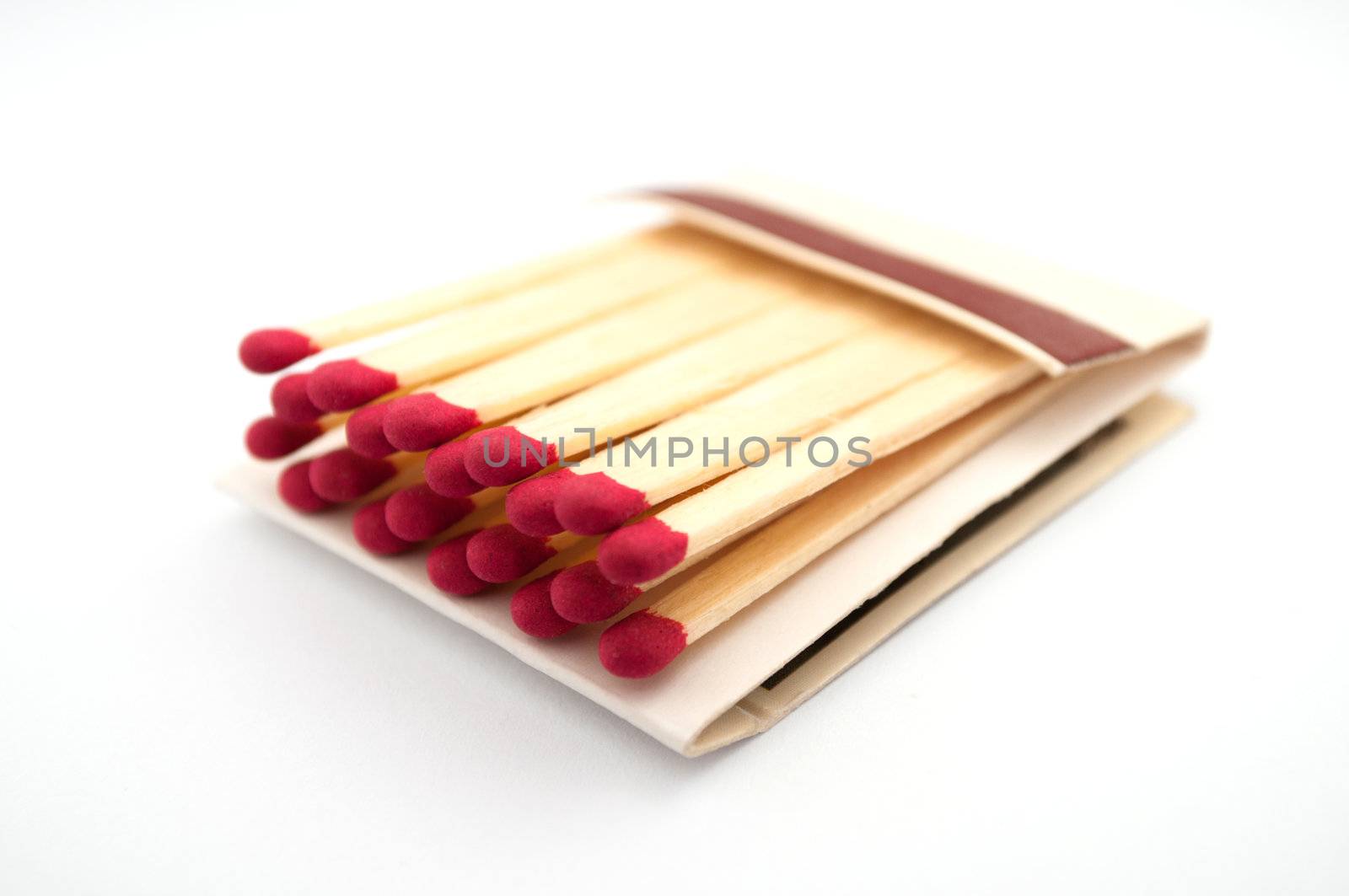 Close up shot of an open matchbook with red heads