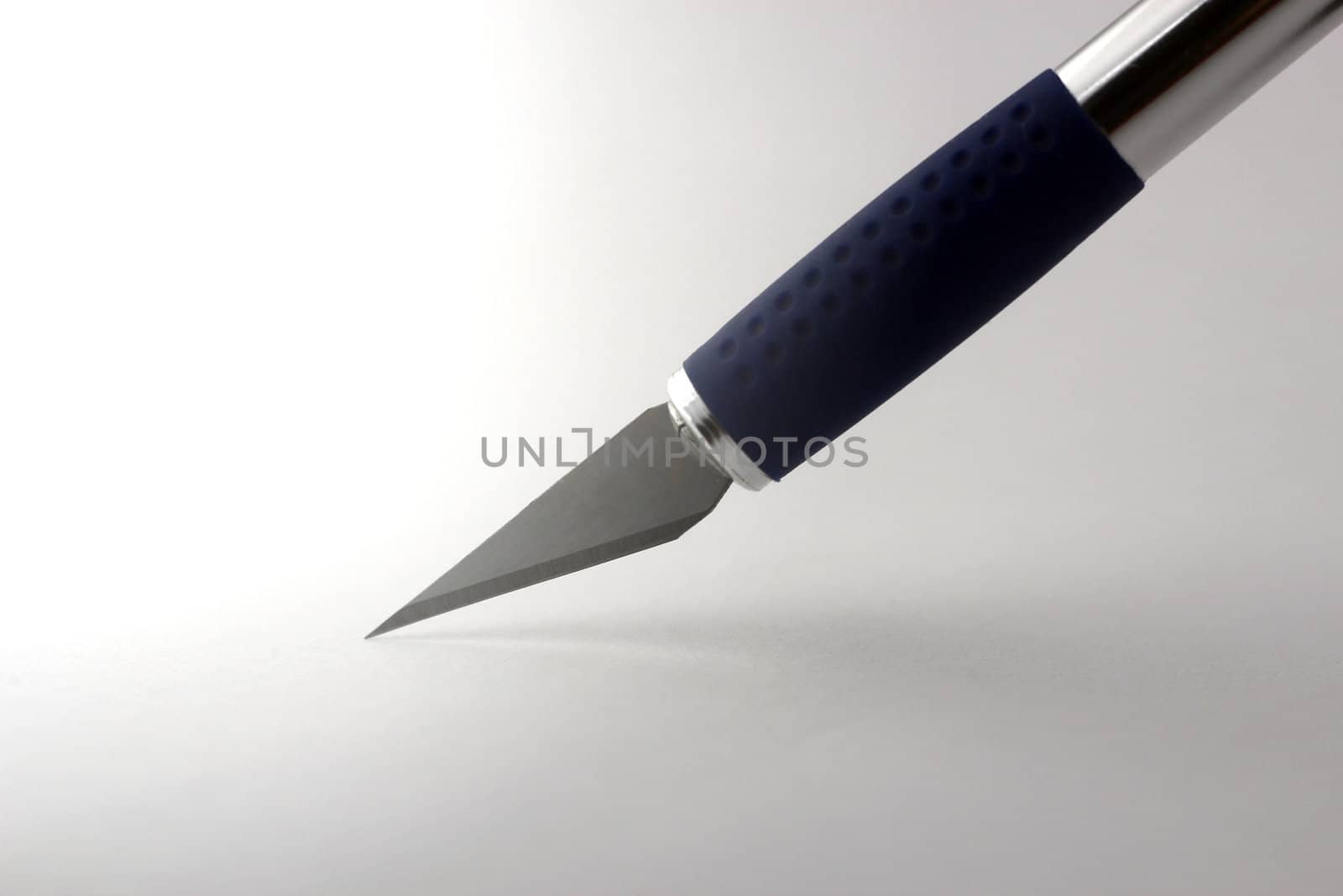 Sharp razorblade cutting paper by catalinr