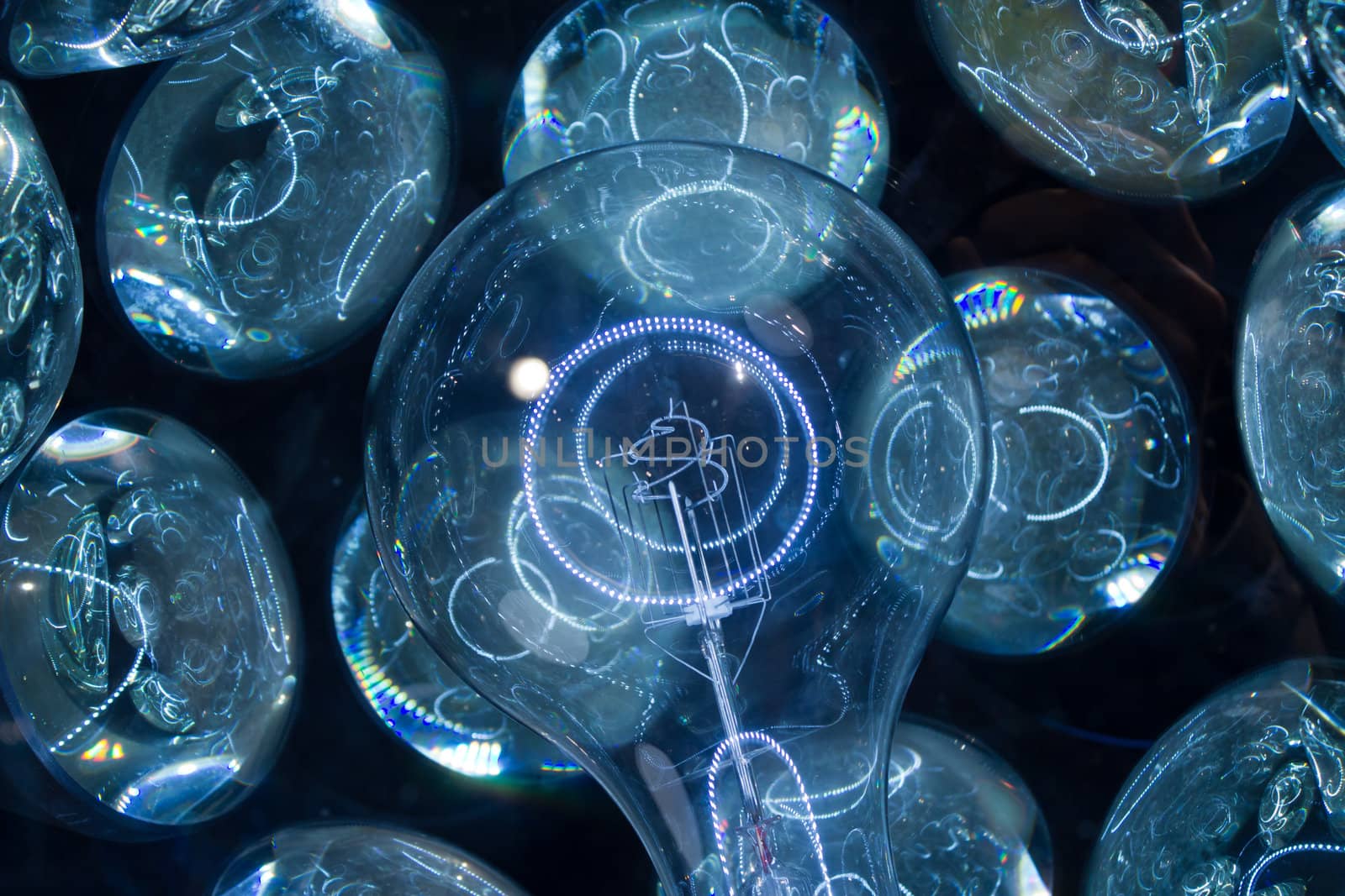 The inside lamp of an old planetarium surrounded by lenses