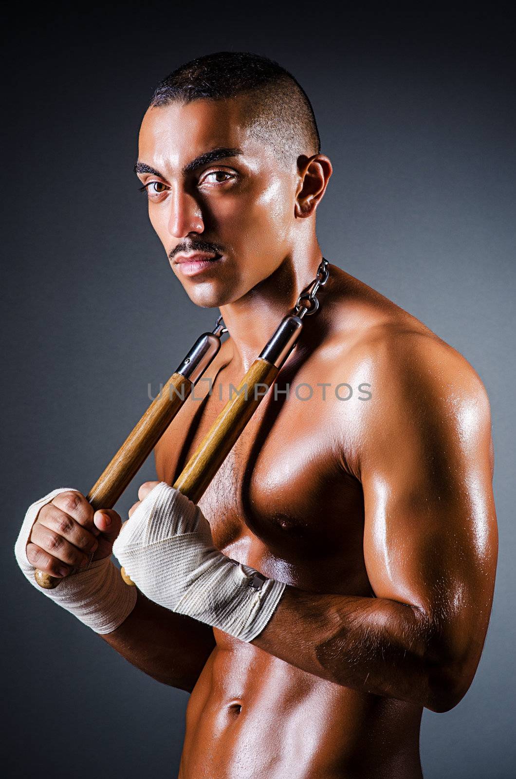 Strong man with nunchaku