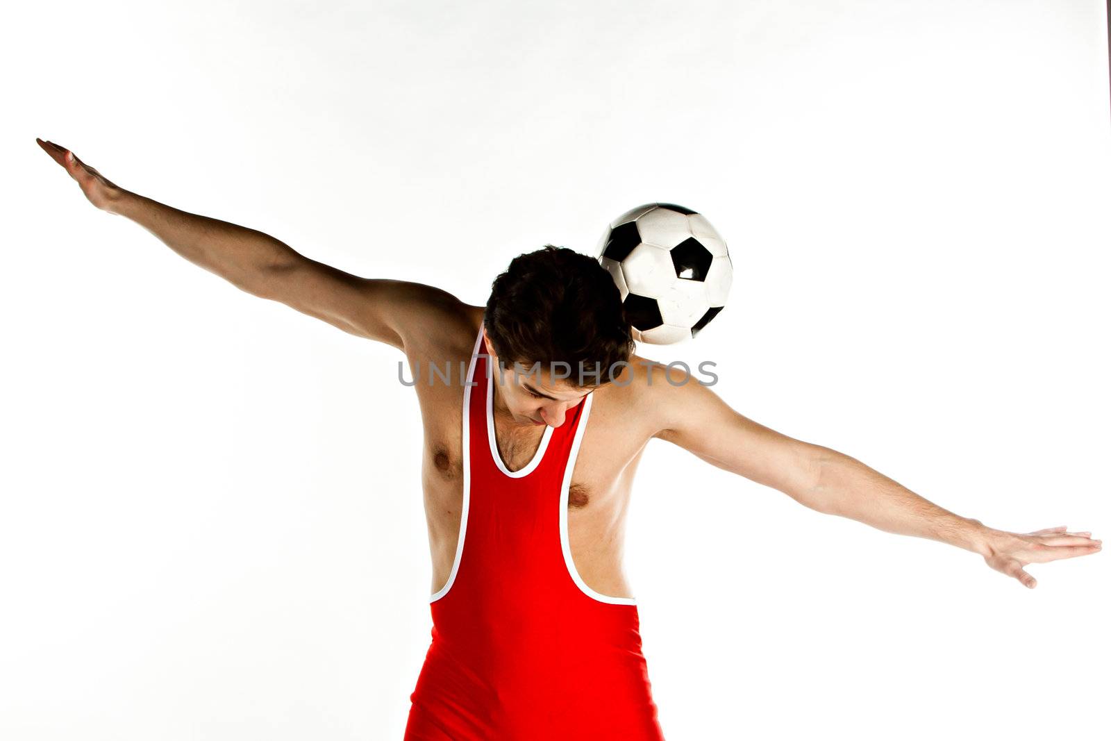 Young and handsome man with a soccer ball gymnast