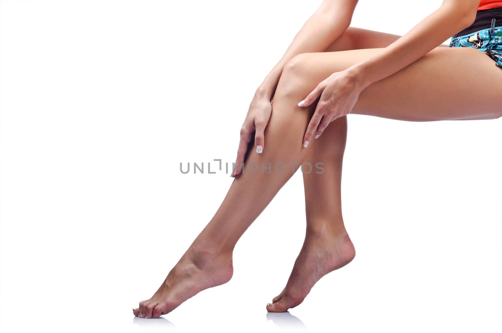 Long woman legs isolated on white