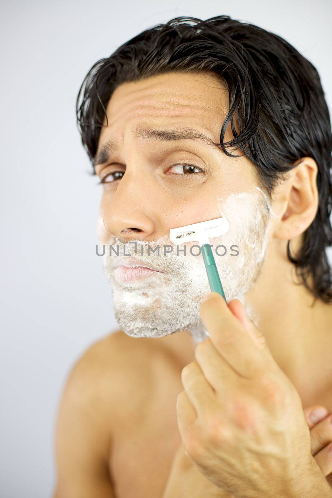 Handsome cool man scared of shaving face by fmarsicano