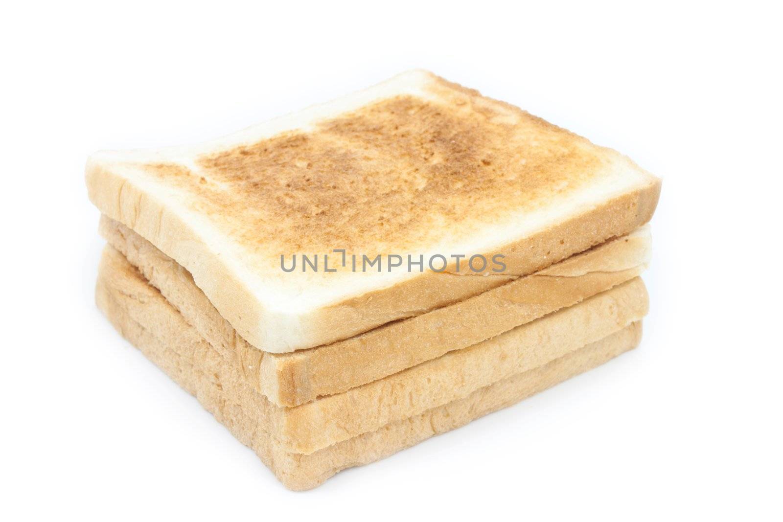 Stack of toasted bread on white background