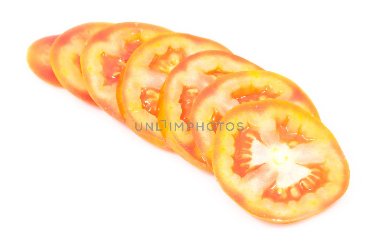 Fresh tomato chopped in line on white isolated