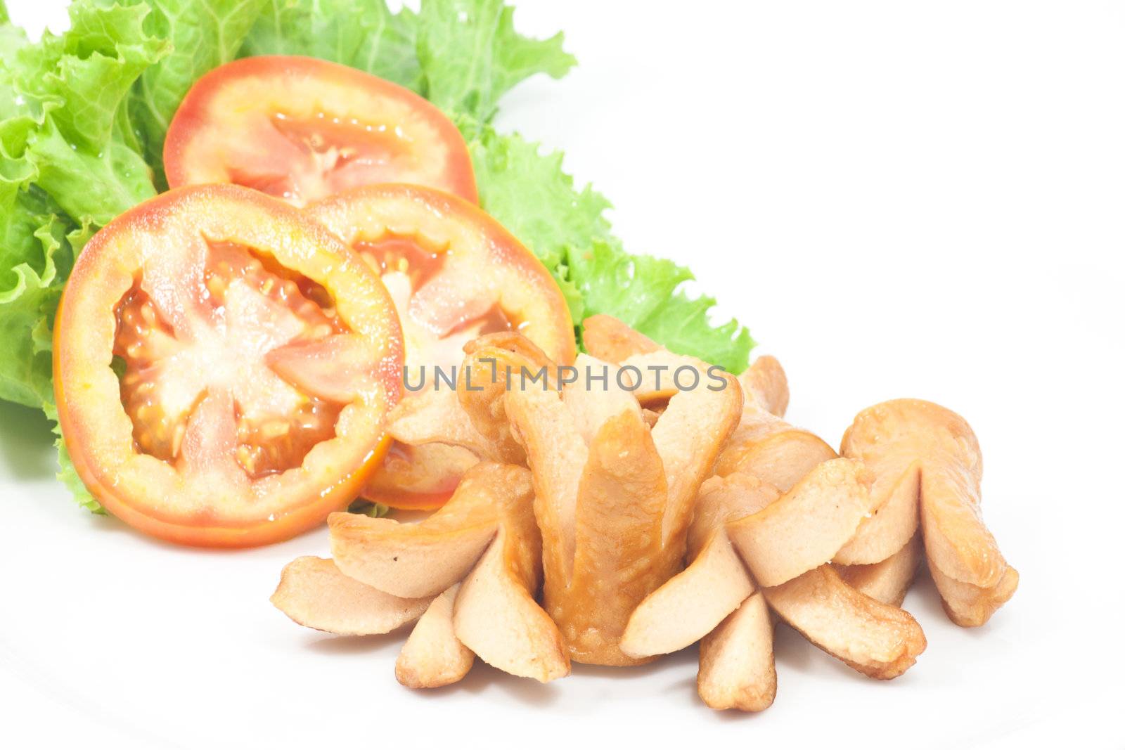 Fries sausage with vegetables on white background