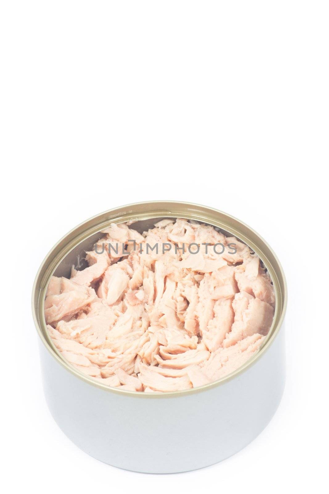 Tuna in vegetable oil in opened can on white isolated
