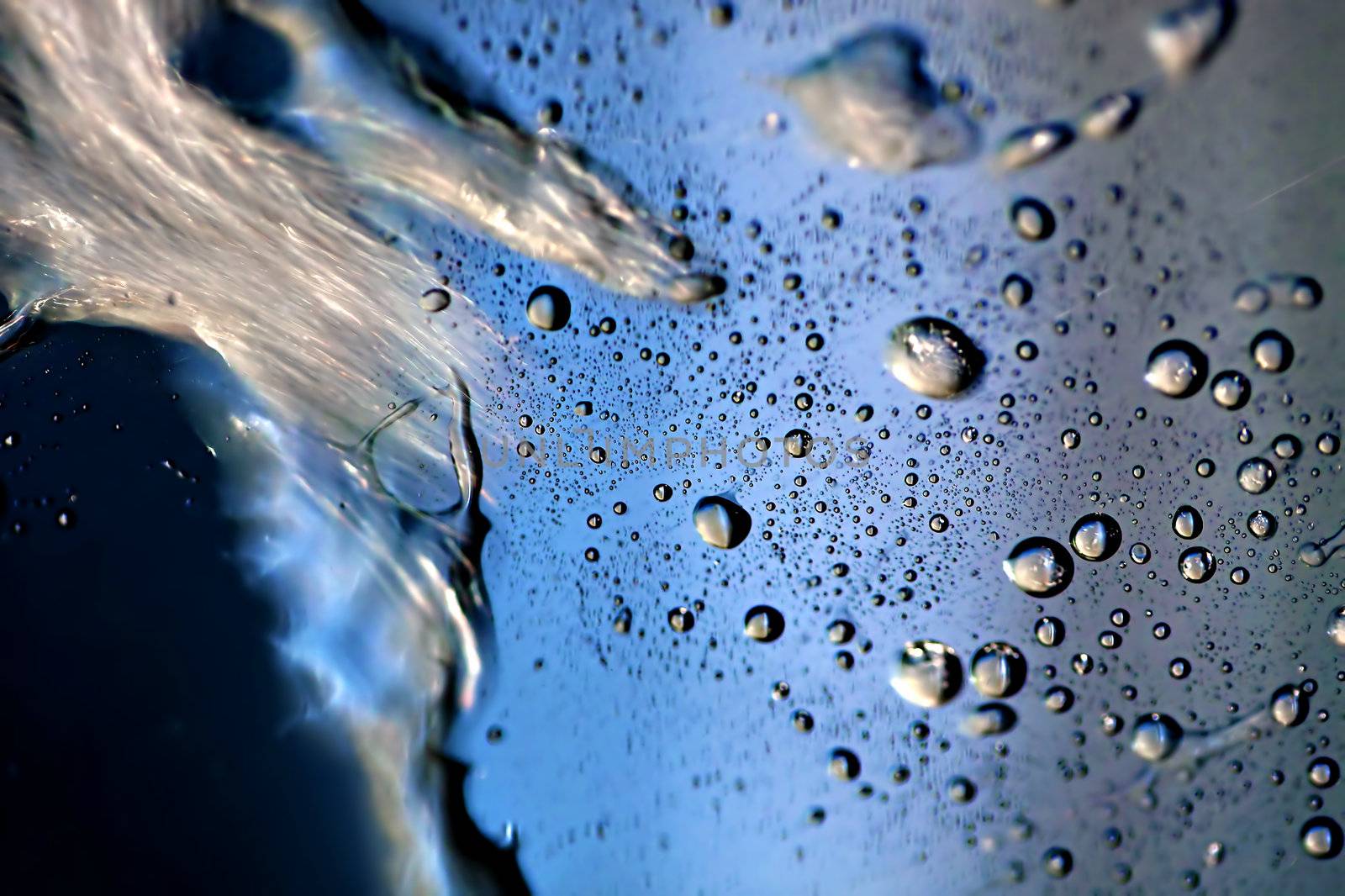 Macro picture of water droplets on window, shallow DOF