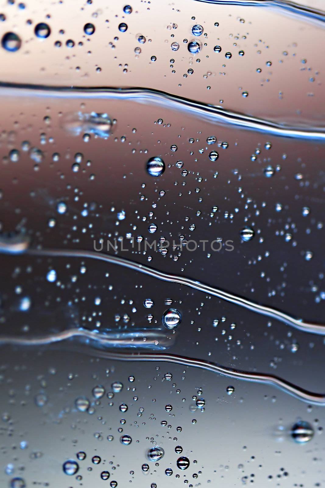 Macro picture of water droplets on window, shallow DOF
