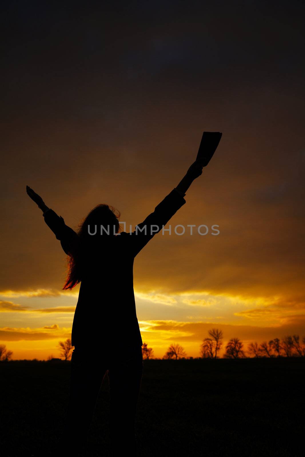 Woman staying with raised hands by AndreyKr