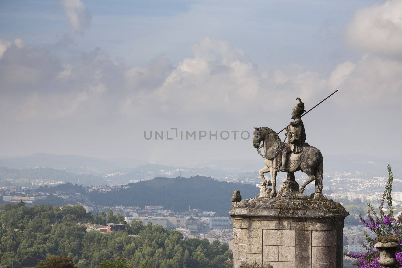 Equestrian statue of Saint Longinus in front of Bom Jesus do Monte with Braga, Portugal in the background.