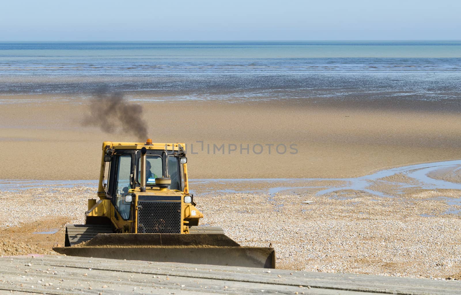 Bulldozer working on sea defence